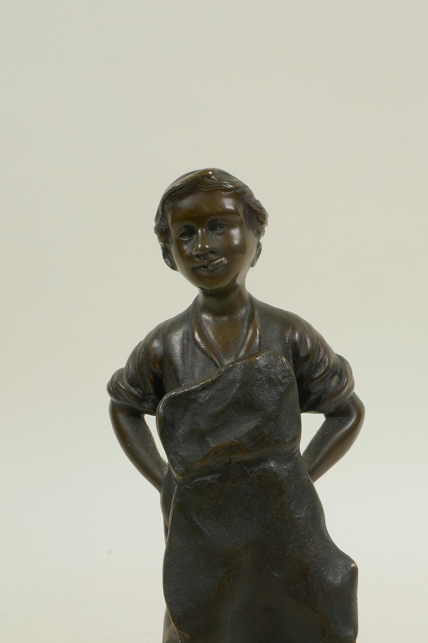 A bronze figure of a child cobbler, 8½" high, indistinctly signed verso - Image 2 of 3