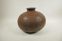 An Indian bulbous iron water pot of riveted construction, 12" diameter