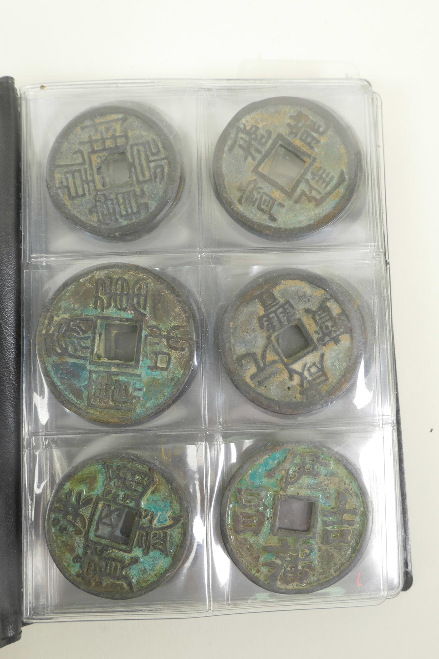 A wallet of Chinese facsimile (replica) bronze coinage, 1½" diameter - Image 4 of 5
