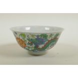 A Chinese doucai porcelain rice bowl decorated with dragons and lotus flowers, 6 character mark to