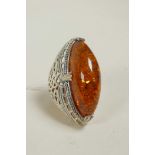 A large 925 silver dress ring set with an amber style stone
