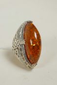 A large 925 silver dress ring set with an amber style stone