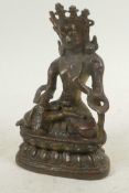 A cast bronze figure of Buddha seated in meditation on a lotus throne, 6" high