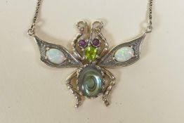 A 925 silver pendant necklace in the form of a winged insect, set with semi-precious stones, 1½"