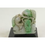 A Chinese jade seal blank, carved with fish and water plants, 2½" high