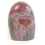 A Chinese soapstone seal with carved decoration of a figure in a landscape, 5" high