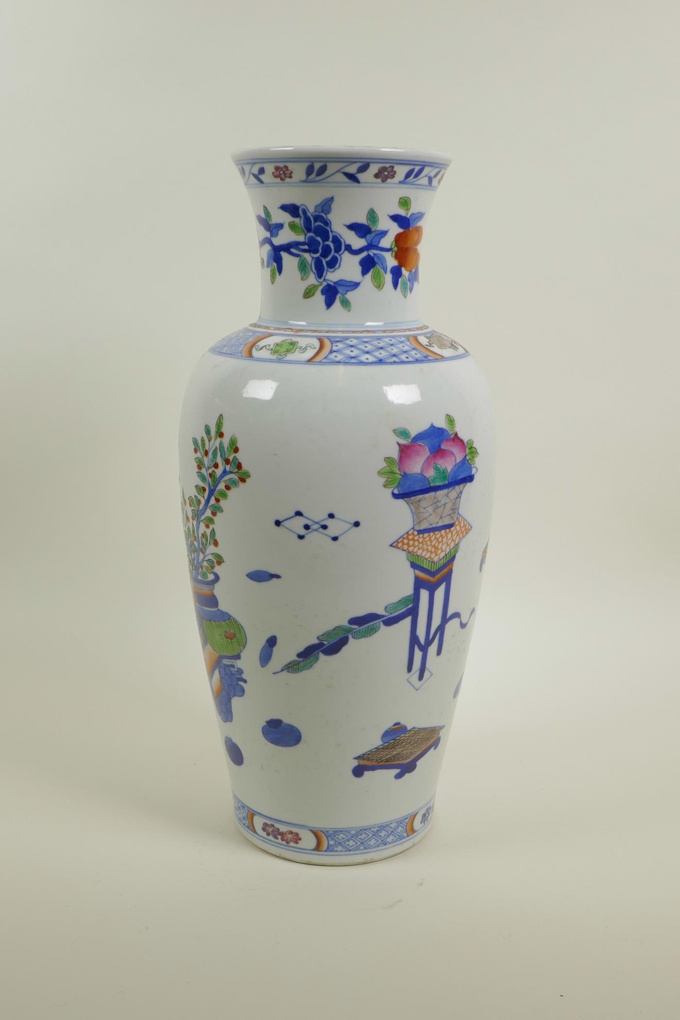 A Chinese polychrome porcelain vase decorated with objects of virtu, auspicious flowers and fruit, 6 - Image 2 of 4