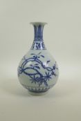 A Chinese blue and white porcelain pear shaped vase decorated with Asiatic foliage in bloom, 6