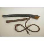 An ethnic wood club, 19" long, and a leather bound whip