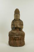 A Chinese carved, painted and distressed wood figure of Quan Yin, 14½" high