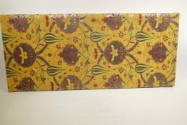 A Turkish Islamic fabric panel on a wooden stretcher, 16" x 37"