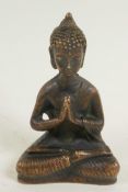 A bronze figure of Buddha, seated in meditation, 3½" high