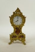 A French Rococo mantel clock by Arnold, with ormolu mounts, 7½" high