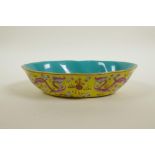 A Chinese polychrome porcelain shaped bowl with blue and pink enamelled dragon decoration on a