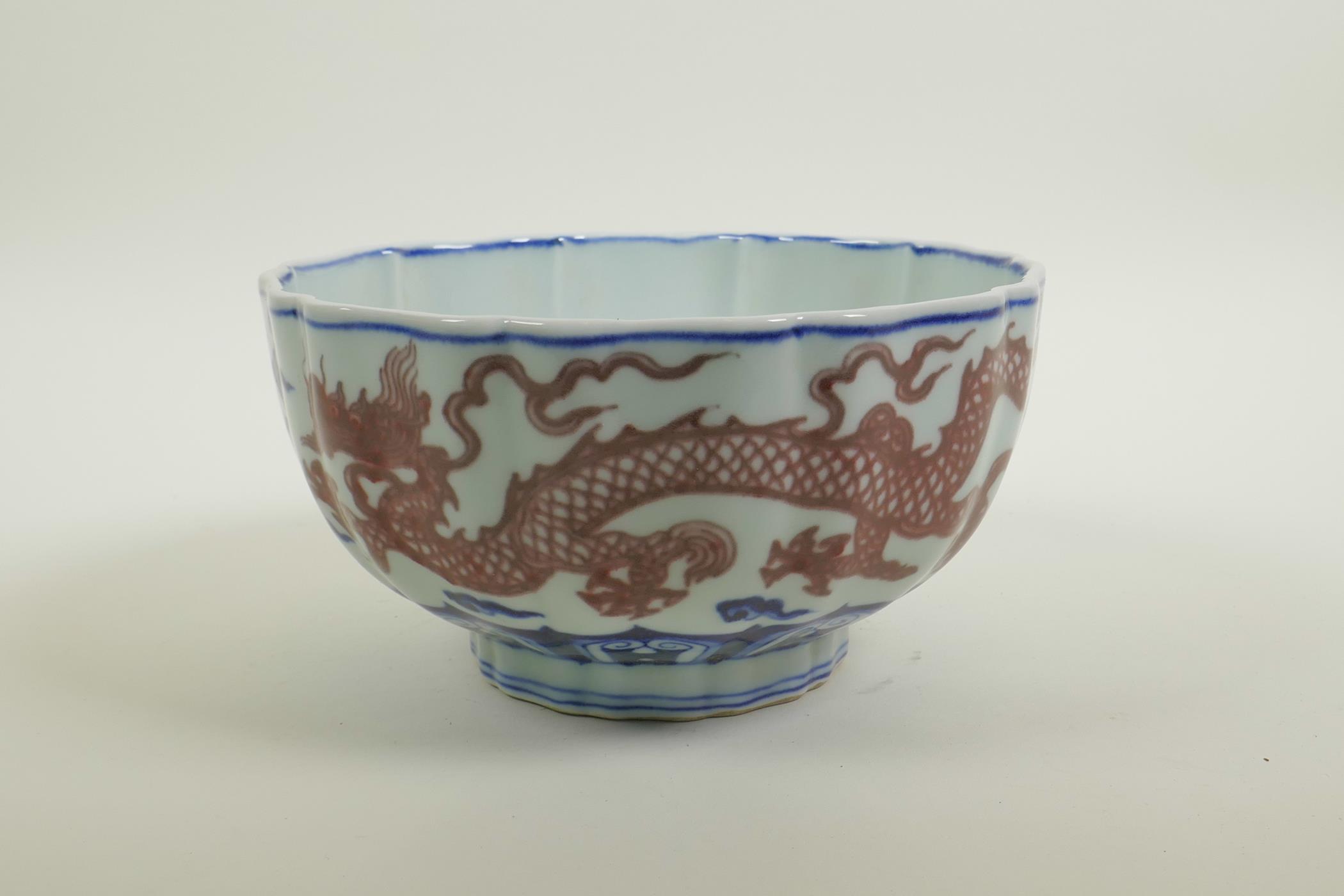 A Chinese blue and white porcelain bowl of lobed form, decorated with iron red dragons to exterior - Image 3 of 5