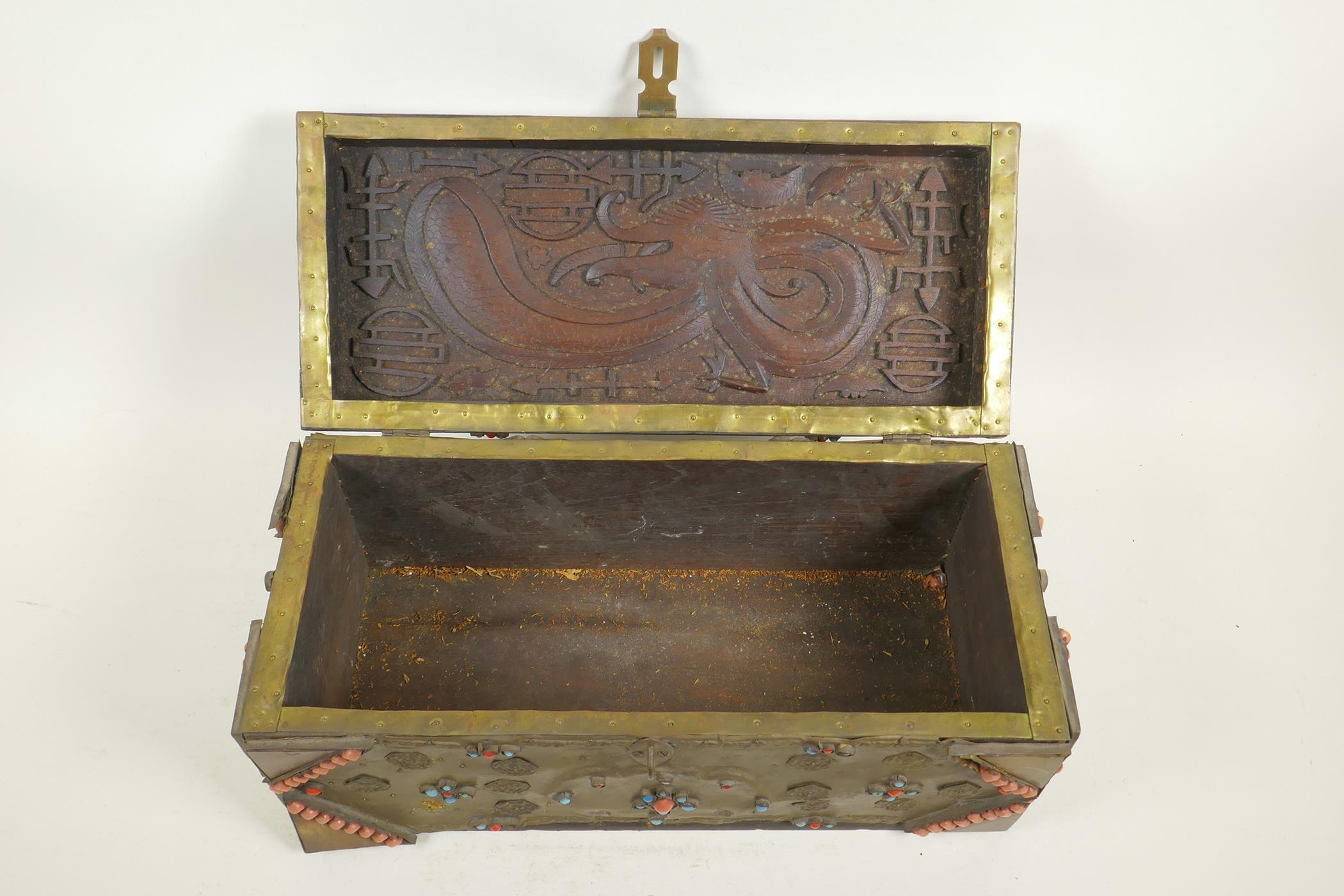 A Sino-Tibetan brass bound carved hardwood casket, with dragon and auspicious symbol decoration, and - Image 5 of 5