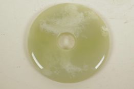 A Chinese polished hardstone pi disc, A/F, 5¼" diameter