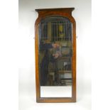 A C19th wall mirror in mahogany, with decorative feather banding on the borders and a simple
