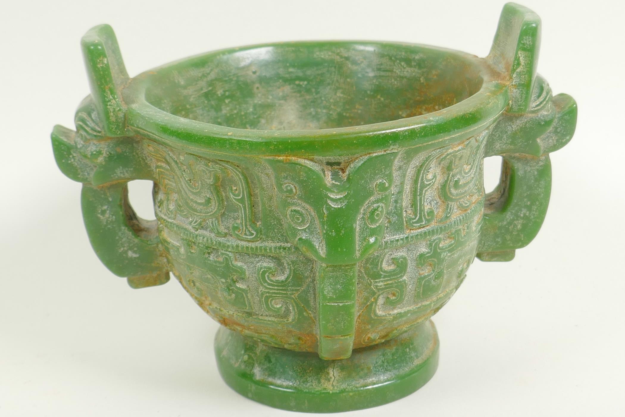 A Chinese carved green hardstone censer with two mask handles on pedestal base carved with birds and - Image 2 of 5