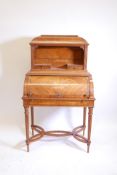 A C19th inlaid satinwood cylinder top bonheur du jour, with a fitted interior and pull out writing