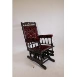 An American mahogany rocking chair, with turned spindles and carved details, A/F
