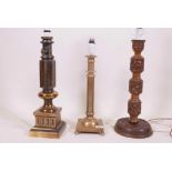 A Burmese carved wood table lamp, 19" high, and two brass table lamps