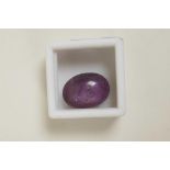 A 35.00ct natural star ruby, purple/pink cabochon, six ray effect, certified by Gemological