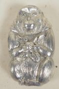 An Oriental white metal vesta case in the form of a monkey, 2½" long