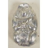 An Oriental white metal vesta case in the form of a monkey, 2½" long