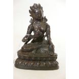 A Bronze Buddhistic figure, seated upon a lotus throne, with distressed gilt decoration, 7" high