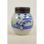 An early C20th Chinese blue and white porcelain ginger jar with a hardwood cover decorated with
