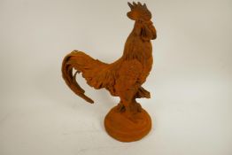 A cast metal garden figure of a cockerel, 17½" high