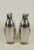 A pair of chrome plated cocktail shakers in the form of penguins, 9" high