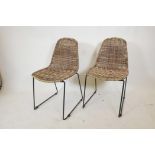 A pair of contemporary Habitat 'Mickey' rattan chairs, 33" high