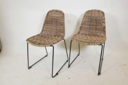 A pair of contemporary Habitat 'Mickey' rattan chairs, 33" high