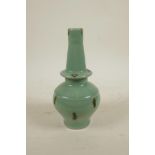 An Oriental celadon glazed porcelain vase with treacle splash glaze, 8½" high