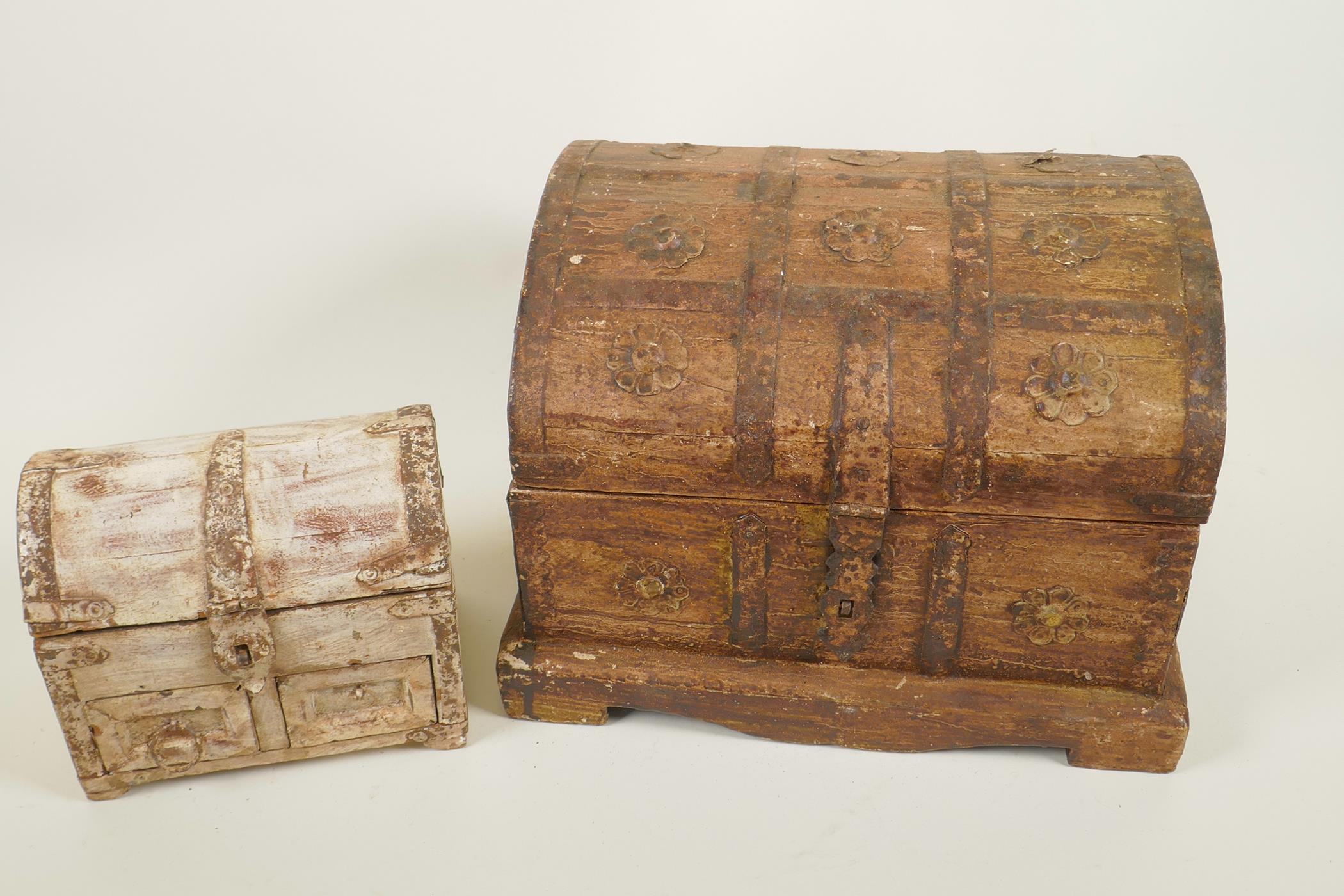 Two metal bound dome top jewellery caskets with antiqued patination, largest 10" wide