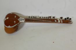 A vintage sitar with bone inlaid decoration, A/F, 47" long