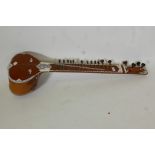 A vintage sitar with bone inlaid decoration, A/F, 47" long