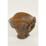 A Chinese faux horn libation cup decorated with archaic symbols and exotic beasts, 5" high