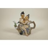 A Chinese porcelain teapot, in the form of an amorous couple, 8" high