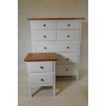 A pine topped white painted wood chest of drawers, four short over three long, and a matching two