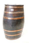 An antique coopered beer keg converted to a collection box, 24½" high