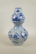 A Yuan style blue and white double gourd vase with crane and lotus flower decoration, 13"high