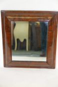 A C19th walnut cushion framed wall mirror, 19" x 21½"