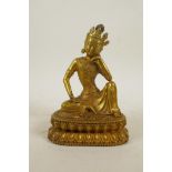 A Sino-Tibetan gilt bronze of Buddha seated on a lotus throne, 7½" high