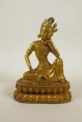 A Sino-Tibetan gilt bronze of Buddha seated on a lotus throne, 7½" high