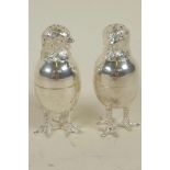 A pair of silver plated salt and peppers cast in the form of chickens, 3" high
