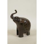 A Sino-Tibetan bronze incense burner and cover in the form of an elephant, 6½" high