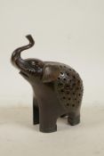 A Sino-Tibetan bronze incense burner and cover in the form of an elephant, 6½" high